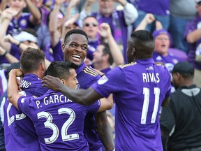 Cyle Larin #9 of Orlando City SC celebrates his goal with Matias Perez Garcia #32 and Carlos Rivas #11 and Antonio Nocerino #23 of Orlando City SC during a MLS soccer match between New York City FC and Orlando City SC at the Orlando City Stadium on March 5, 2017 in Orlando, Florida. (Photo by Alex Menendez/Getty Images)