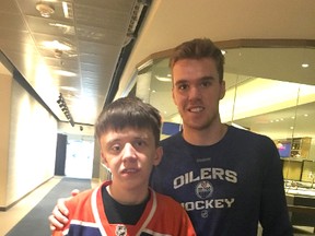 Ryan Hauck, left, with Edmonton Oilers captain Connor McDavid. Photo supplied