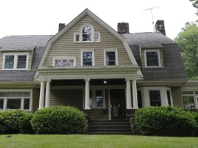 In this June 25, 2015, file photo, the home of Derek and Maria Broaddus in Westfield, N.J. is viewed. The couple wants to demolish the house after they claim they were stalked by an anonymous creepy-letter writer known as "The Watcher" has filed a lawsuit against their town. (AP Photo/Julio Cortez, File)