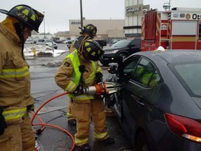 Ottawa firefighters responding to a collision near Carlingwood Shopping Centre, where one man was extricated.