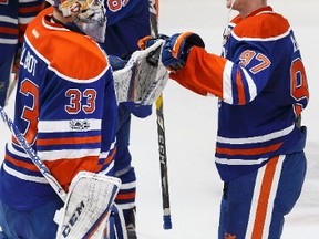 Edmonton's Connor McDavid (97) celebrates his game winning overtime goal with goaltender Cam Talbot (33) during a NHL game between the Edmonton Oilers and the Florida Panthers at Rogers Place in Edmonton, Alberta on Wednesday, January 18, 2017.