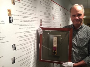 Elgin County Museum curator Mike Baker shows off the Victoria Cross medal awarded posthumously to Vimy Ridge solider Ellis Wellwood Sifton. Sifton single-handedly launched an assault on a German machine-gun nest, capturing the Axis stronghold before he was killed. The museum is hosting a special seminar to mark the 100th anniversary of his death on April 9 in Wallacetown, Sifton’s hometown. See story page 3. (Jennifer Bieman/Times-Journal)