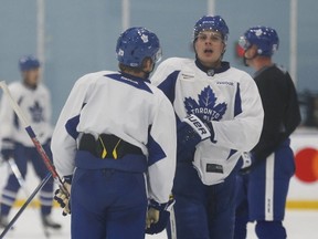 Maple Leafs centre Auston Matthews (right) talks with William Nylander (29) as they prepare for the Panthers Tuesday night in Toronto on Monday, March 27, 2017. (Jack Boland/Toronto Sun)