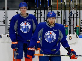 Edmonton Oilers forward Leon Draisaitl (right) and captain Connor McDavid practise in Edmonton on Monday, March 27, 2017. (Larry Wong)