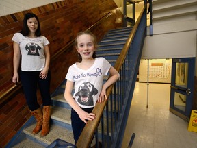 Ava Bright, shown above with her mom, Julie Brown, at Lord Roberts French immersion school Monday, travelled to Portland, Ore., recently to meet a black Labrador retriever named Rowdy, that has the same skin condition Ava has. (MORRIS LAMONT, The London Free Press)