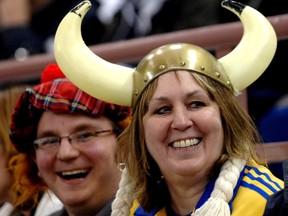 Curling fans Marj Westergard, right, and son Rhyan cheer on Team Sweden at the Ford World championships in Edmonton on April 5, 2007. (Ed Kaiser)