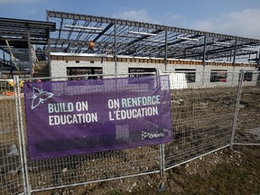 Construction proceeds on a new elementary school on Cedarhollow Boulevard, east of Highbury Ave, on Wednesday February 22, 2017. (MORRIS LAMONT, The London Free Press)