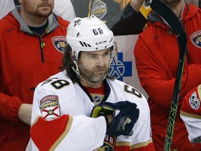 Florida Panthers' Jaromir Jagr acknowledges fans at the end of a video tribute to his time playing with the Pittsburgh Penguins during a timeout in the first period of an NHL hockey game against the Penguins in Pittsburgh, Sunday, March 19, 2017. (AP Photo/Gene J. Puskar)