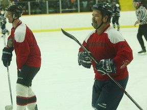 Although Huron East Fire Department lost the hockey game against the Huron OPP everyone was still smiling.(Shaun Gregory/Huron Expositor)