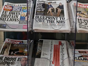 Newspapers are seen displayed for sale in London, Tuesday, March 28, 2017.  (AP Photo/Kirsty Wigglesworth)