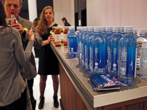 In this March 8, 2017 photo, bottles of water and flavored tea are displayed during The Shine, an alcohol-free social social event at a chic hotel in the Williamsburg neighborhood in the Brooklyn borough of New York. These events, which are popping up in New York, Los Angeles and Chicago, are part of a trend fueled by millennials seeking to find meaningful connections while they party, (AP Photo/Kathy Willens)