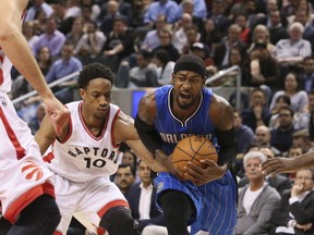 Terrence Ross drives around pal DeMar DeRozan in his Toronto return on Monday. Veronica Henri/Postmedia Network