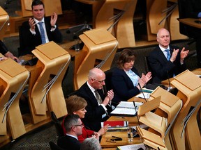 Scottish National party MSP's applaud after the vote on a second referendum on independence was carried at Scotland's Parliament in Holyrood, Edinburgh on March 28, 2017. (RUSSELL CHEYNE/AFP/Getty Images)