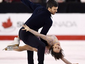 Meagan Duhamel and Eric Radford perform the senior pair free program during the National Skating Championships in Ottawa on Saturday, Jan. 21, 2017. Canada's two-time defending pairs champion Radford is battling an injury on the eve of the world figure skating championships.THE CANADIAN PRESS/Sean Kilpatrick