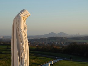 Master Corporal Jill Cooper, Vimy Imagery Team "Canada Mourns", the front-most sculpture of the Canadian National Vimy Memorial at Vimy Ridge looks toward the city of Arras, France. The 100th anniversary commemoration of the Battle of Vimy Ridge will be held April 9.