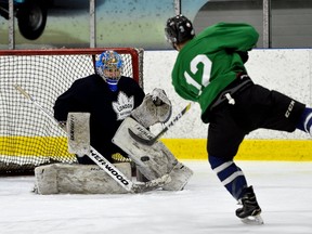 London Nationals defence man Derek Di lorio shoots on goaltender Cameron Zanussi during practice at the Western Fair Sports Centre on Tuesday. (MORRIS LAMONT, The London Free Press)