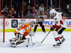 Flyers goalie Steve Mason (left) blocks a shot by Senators' Tom Pyatt in the shootout of an NHL game in Philadelphia on Tuesday, March 28, 2017. (Matt Slocum/AP Photo)