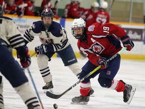 A member of the North Bay Trappers looks to make a pass against the Windsor AAA Midgets during Telus Cup Central Regional Championships action at Gerry McCrory Countryside Sports Complex on Tuesday. Gino Donato/The Sudbury Star