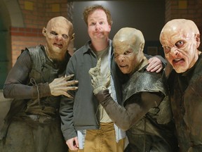 In this April 16, 2003 file photo, Buffy the Vampire Slayer creator Joss Whedon is surrounded by vampires during the taping of the final episode of the cult comedy-horror series in Santa Monica, Calif. (AP Photo/Damian Dovarganes, file)