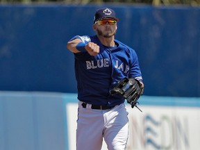 Toronto Blue Jays third baseman Josh Donaldson throws out Detroit Tigers' James McCann at first base during the second inning of a spring training baseball game Wednesday, March 22, 2017, in Dunedin, Fla. (AP Photo/Chris O'Meara)