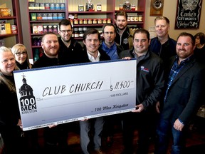 Travis Blackmore, third from left, accepts a check on behalf of Club Church Ministries from Brad Revell, middle, of One Hundred Men Who Care Kingston at Cooke's Fine Foods on Princess Street on Wednesday. The group donated $11,400 towards a refrigerated truck for the ministries. Also in the photo are, from left, Corrie Abrams and Dawn Blackmore from Club Church Ministries, Matt Sablowski, Jeff Stafford, Jeremy Dawe from Club Church Ministries, Marco DiPietrantonio, Greg Stevenson, and Rob Colangeli. Ian MacAlpine /The Whig-Standard/Postmedia Network