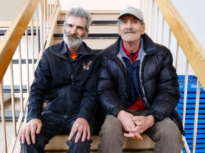 Luke Hendry/The Intelligencer
Brothers Bill, left, and Mike Horsburgh sit in the stairwell of the Salvation Army building Tuesday in Belleville. Separated for years, they searched for each other and reunited after Mike read an Intelligencer story which mentioned Bill's volunteer role with the Army.