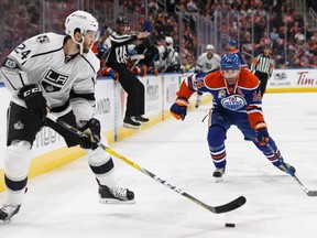Edmonton's Jordan Eberle (14) battles LA's Derek Forbort (24) during the second period of a NHL game between the Edmonton Oilers and the LA Kings at Rogers Place in Edmonton on Tuesday, March 28, 2017.
