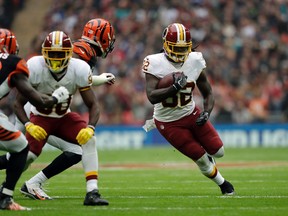 Redskins running back Rob Kelley (32) runs with the ball against the Bengals defence during NFL action at Wembley Stadium in London, England, on Oct. 30, 2016. (Tim Ireland/AP Photo)