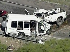 This aerial image made from a video provided by KABB/WOAI shows a deadly crash involving a van carrying church members and a pickup truck on U.S. 83 outside Garner State Park in northern Uvalde County, Texas, Wednesday, March 29, 2017. The group of senior adults from First Baptist Church of New Braunfels, Texas, was returning from a retreat when the crash occurred, a church statement said. (KABB/WOAI via AP)