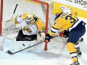 Sarnia Sting goalie Justin Fazio makes a save on Warren Foegele of the Erie Otters in Game 4 of their OHL Western Conference quarter-final at Erie Insurance Arena in Erie, Pa., on Wednesday, March 29, 2017. (JACK HANRAHAN/Erie Times-News)