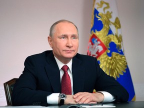 Russian President Vladimir Putin listens during a live video link with Russian Arctic natural gas port Sabetta, in Arkhangelsk, Russia, Thursday, March 30, 2017. (Alexei Druzhinin/Sputnik, Kremlin Pool Photo via AP)