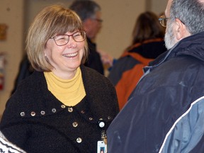 Chatham-Kent Health Alliance CEO and president Lori Marshall smiles, as she talks to Doug Cameron at a CKHA open house held at the CBD Club on Thursday March 23.