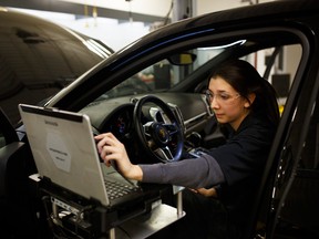 Meagan Martino, a mechanic with Pfaff Porche in Woodbridge, spends as much time in front of a diagnostics screen as she does under the hood.
