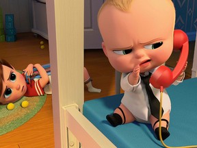 This image released by DreamWorks Animation shows characters Tim, voiced by Miles Bakshi, and Boss Baby, voiced by Alec Baldwin in a scene from the animated film, "The Boss Baby." (DreamWorks Animation via AP)