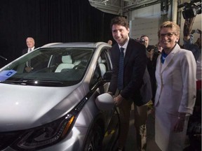 Prime Minister Justin Trudeau and Premier Kathleen Wynne at a Ford even in Windsor which included an announcement that Ford will spend as much as $337.9 million on a new research and development centre in Ottawa that will focus on developing self-driving vehicles. CHRIS YOUNG / THE CANADIAN PRESS