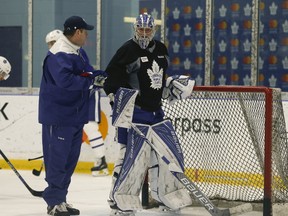 Toronto Maple Leafs Frederik Andersen talks with coach D.J. Smith Wednesday, March 29, 2017 as he worked out as part of the optional skate in preparation for their road trip to Nashville Predators. (Jack Boland/Toronto Sun)