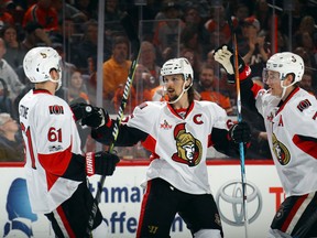 Mark Stone (from left), Erik Karlsson and Kyle Turris of the Ottawa Senators celebrate a goal against the Philadelphia Flyers at the Wells Fargo Center on March 28, 2017 in Philadelphia. (Bruce Bennett/Getty Images)