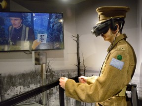 Goderich?s Charles Barlow, on a First World War re-enactor, experiences the Battle of Vimy Ridge through a new virtual reality exhibit at London?s RCR Museum. (MORRIS LAMONT, The London Free Press)