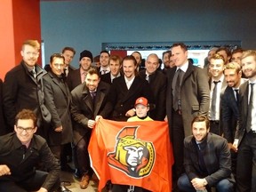 The Senators visit with Jonathan Pitre during a trip to Minneapolis on Wednesday, March 29, 2017. (Bruce Garrioch/Postmedia Network)