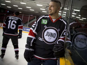 Adrian Sutherland of Midnight Shine took a moment on the ice for a quick photo. Canadian music celebrities and hockey stars came together at TD Place arena Thursday March 30, 2017 for a practice a day before the big Juno Cup hockey game. Ashley Fraser/Postmedia ASHLEY FRASER / POSTMEDIA