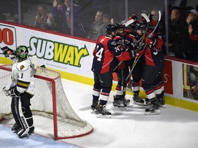 The Windsor Spitfires celebrate a first period goal by Graham Knott as London Knights goaltender Tyler Parsons looks away during first period playoff action at the WFCU Centre in Windsor, Ontario on March 30, 2017. (JASON KRYK/Windsor Star)