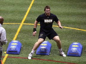 University of Manitoba Bisons product Geoff Gray is put through a drill by Green Bay Packers scout Alonzo Dotson during his pro day before NFL scouts at the south soccer complex in Winnipeg on Thursday, March 30, 2017. (Kevin King/Winnipeg Sun)