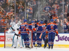 The Edmonton Oilers celebrate a goal against San Jose Sharks goalie Martin Jones in Edmonton on Thursday, March 30, 2017. (Jason Franson/The Canadian Press)