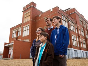 Pierre Asselin and his children Olivier Asselin, 10, Geneviève Asselin, 13, and François Asselin, 16, pose for a photo outside Ecole Joseph-Moreau, 9750 - 74 Ave., in Edmonton Thursday March 30, 2017. Photo by David Bloom