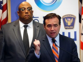Cincinnati Mayor John Cranley speaks alongside Police Chief Eliot Isaac, left, during a news conference in connection to the Cameo nightclub shooting Thursday, March 30, 2017, in Cincinnati. (AP Photo/John Minchillo)