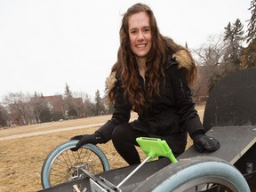 Natasha Pye, second year University of Alberta engineering physics student and assistant project manager for the Eco Car Team, poses for a photo with a new zero-emissions vehicle that engineering students designed and built, in Edmonton Thursday March 30, 2017. Photo by David Bloom