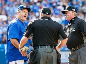 Blue Jays manager John Gibbons gets ejected in the 9th after questioning a call as the Toronto Blue Jays lose to the Boston Red Sox at the Rogers Centre in Toronto on September 11, 2016. (Stan Behal/Toronto Sun)