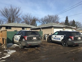 Two cop cars on scene after a stabbing in northwest Edmonton. Clare Clancy/Postmedia