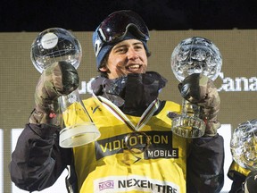 Mark McMorris raises his Crystal Globes at the FIS Snowboard World Cup Big Air event in downtown Quebec City on February 11, 2017. (THE CANADIAN PRESS/Jacques Boissinot)