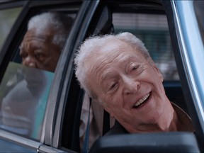 Michael Caine, right, and Morgan Freeman, in background, star in "Going in Style." (Handout)